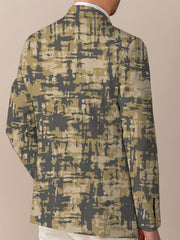 A man wears a regular fit party blazer featuring an abstract camouflage-style print.