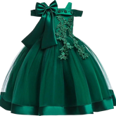A sleeveless emerald green knee-length ball gown for girls featuring floral appliques and a large bow.
