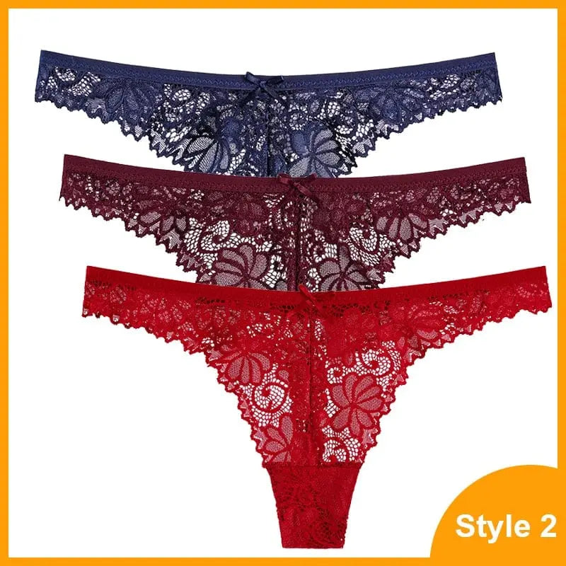 The 3 Pcs Woman Panties Sexy Lace Thong set features navy blue, dark burgundy, and red low-waist G-strings with floral lace and a bow on the waistband, displayed stacked against a white background.