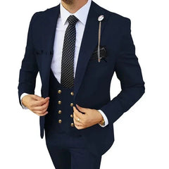 A man wears a navy blue three-piece slim-fit suit with a white shirt and a polka-dot tie.