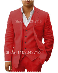 A man wears a red three-piece linen suit consisting of a blazer, vest, and trousers.