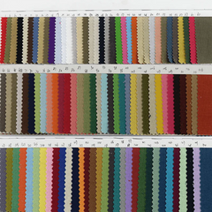 A fabric swatch card displaying a wide variety of colorful linen textile samples in three rows.