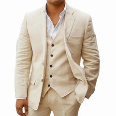 A man wears a beige three-piece linen suit consisting of a blazer, vest, and trousers.