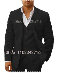 A man wearing a black three-piece linen suit with a white shirt.