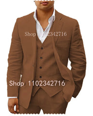 A man wears a brown three-piece linen suit consisting of a blazer, vest, and white dress shirt.