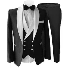 A three-piece black slim-fit tuxedo featuring a white shawl lapel, vest, and matching trousers.