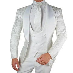 A three-piece white floral tuxedo with a satin shawl lapel and a double-breasted vest.