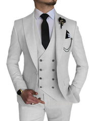 A man wears a light gray three-piece suit featuring a double-breasted vest and a black tie.