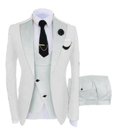 A white three-piece slim fit men's suit featuring a peak lapel blazer, vest, and matching trousers.