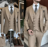 A slim-fit khaki three-piece suit featuring a double-breasted vest and a patterned tie.