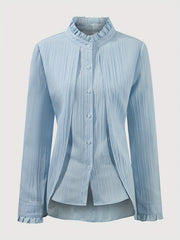 A light blue long-sleeve blouse with a ruffled collar, button-up front, and ruffled cuffs.