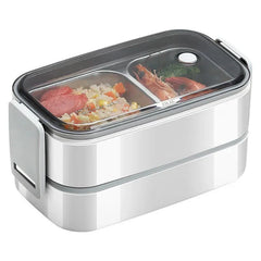 A rectangular two-layer stainless steel bento lunch box with a clear lid and divided compartments.