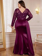 A plus size purple mermaid gown with a sequin lace bodice, long sleeves, and a satin skirt.