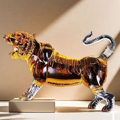 A glass tiger-shaped decanter filled with amber liquid, featuring a clear tail stopper.