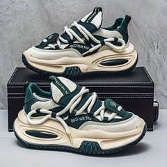 A pair of chunky, dark green and cream-colored men's sneakers with thick, shock-absorbing soles.
