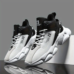 A pair of black and white mid-top men's running shoes with lace-up closures and textured soles.