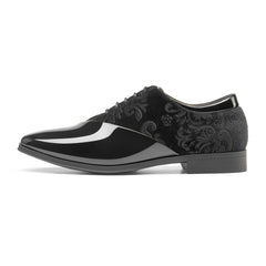A men's formal oxford shoe featuring a black patent leather toe and a patterned velvet quarter.