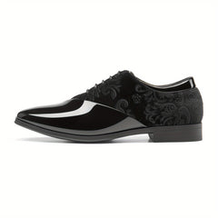 A black men's formal oxford shoe featuring a glossy patent toe and a patterned velvet quarter.