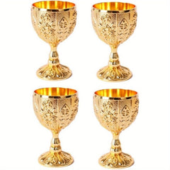 A set of four small gold-colored metal goblets featuring vintage embossed floral patterns.