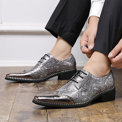 Men's silver-toned lace-up dress shoes featuring a snakeskin pattern and a polished pointed toe.
