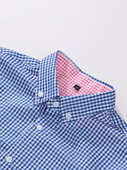 A blue and white gingham button-up shirt with a contrasting pink gingham inner collar.