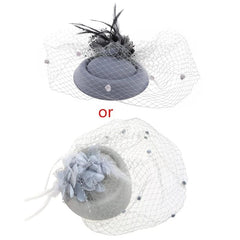 Two gray pillbox fascinator hats decorated with feathers, flowers, and beaded veils.