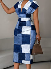 A woman wears a short-sleeved, V-neck bodycon dress featuring a blue and white denim-style patchwork print.
