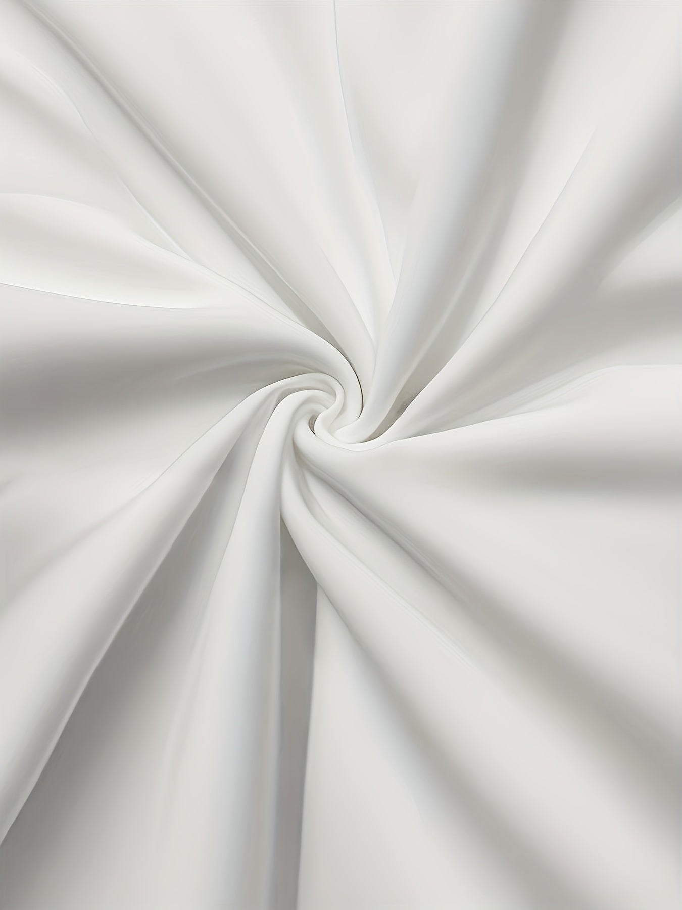 A close-up view of smooth, white, semi-sheer fabric draped in a soft spiral pattern.