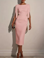 A light pink knee-length pencil dress with a crew neck and pearl-accented split sleeves.