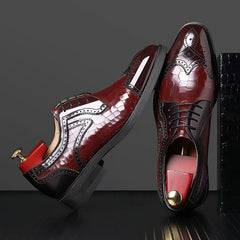 Glossy red men's brogue oxfords with a square toe and intricate wingtip detailing.