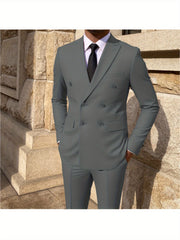 A man wears a grey double-breasted suit with a white shirt and black tie.