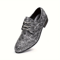 A silver, low-top men's dress shoe with a woven embossed pattern and lace-up closure.
