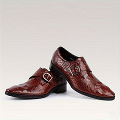 A pair of glossy red crocodile-print men's loafers featuring a pointed toe and a metal buckle.
