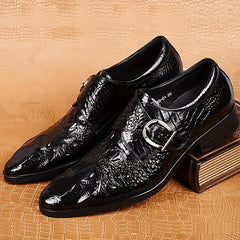 Black crocodile-print pointed-toe loafers featuring a side buckle and a glossy finish.