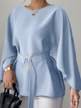 A light blue long-sleeve blouse with a crew neck and a matching belted waist.