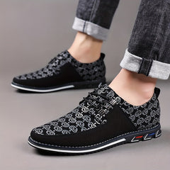 Men's black lace-up casual shoes featuring a geometric pattern and a white rubber sole.