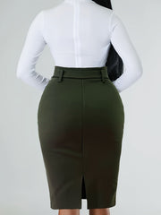 A woman wears a solid olive green belted bodycon skirt with a back slit and a white long-sleeve top.