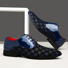 A pair of blue and black plaid lace-up dress shoes with a pointed toe and glossy finish.
