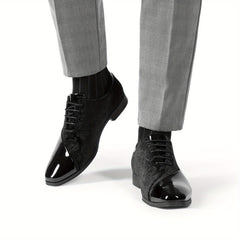 A pair of black men's formal oxford shoes featuring a glossy patent toe and velvet side panels.