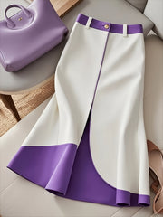 A purple and white color-block A-line skirt with a button closure and flared hem.