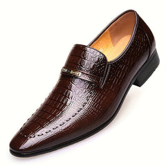Brown crocodile-embossed men's slip-on loafers with a gold-tone metallic emblem.
