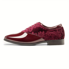 A burgundy men's oxford dress shoe featuring a glossy patent toe and a floral velvet quarter.