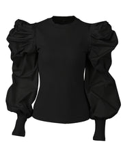 A black ribbed crew neck blouse featuring voluminous puff sleeves with fitted ribbed cuffs.