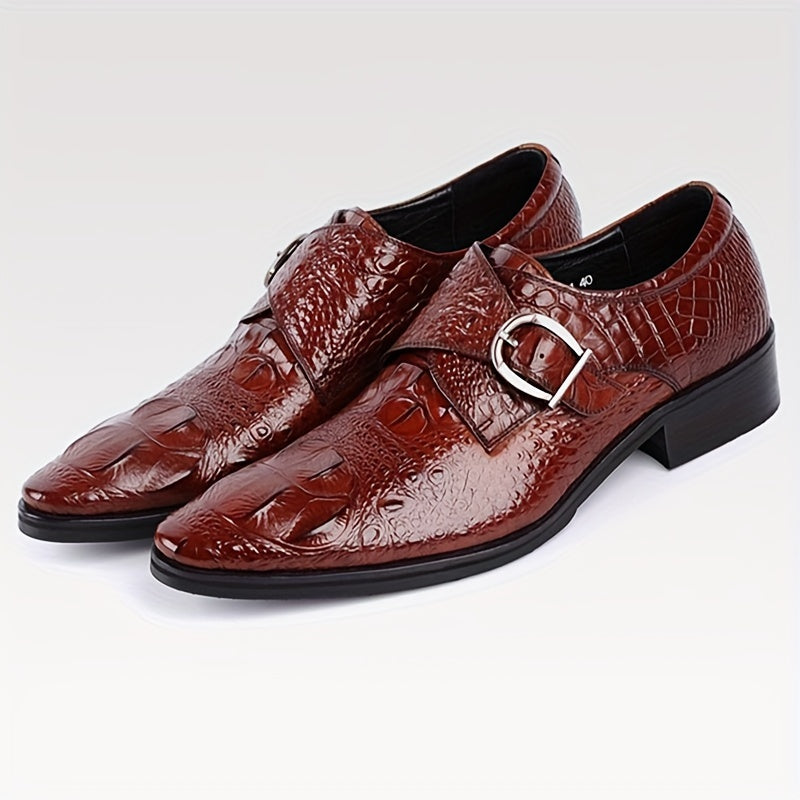 A pair of glossy red men's crocodile print loafers featuring a pointed toe and a metal buckle.