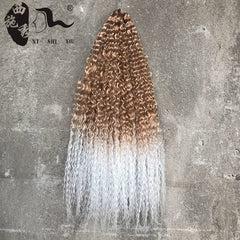 A bundle of long, curly crochet hair extensions featuring an ombre transition from brown to white.