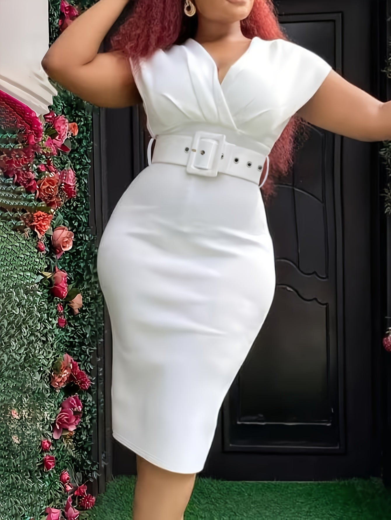 A woman wears a white V-neck bodycon dress with a matching belt and a pencil skirt silhouette.