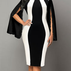 A black and white color block bodycon dress featuring a crew neck and split cape-style sleeves.
