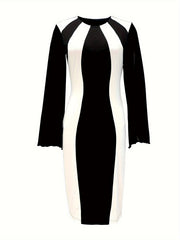 A long-sleeved black and white color block bodycon dress with a crew neck and split cuffs.
