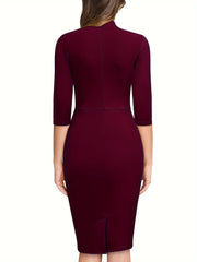 A woman wears a solid burgundy three-quarter sleeve sheath dress with a high neckline.
