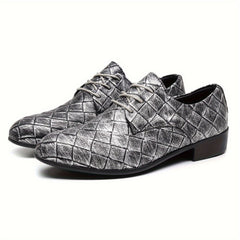 A pair of silver metallic woven lace-up dress shoes with a round toe and low heel.